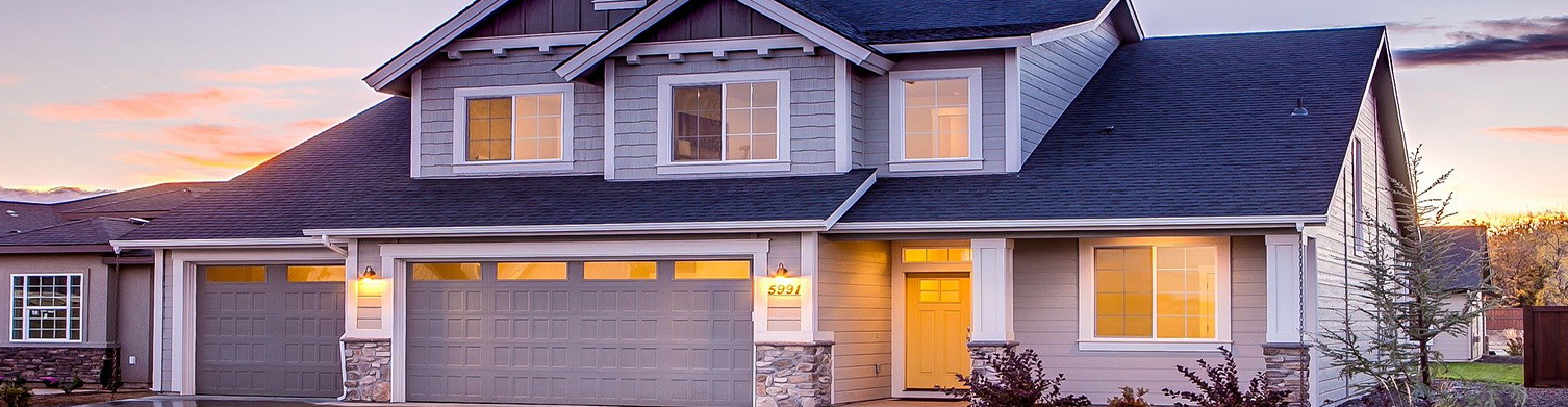 family sitting on the floor with moving boxes